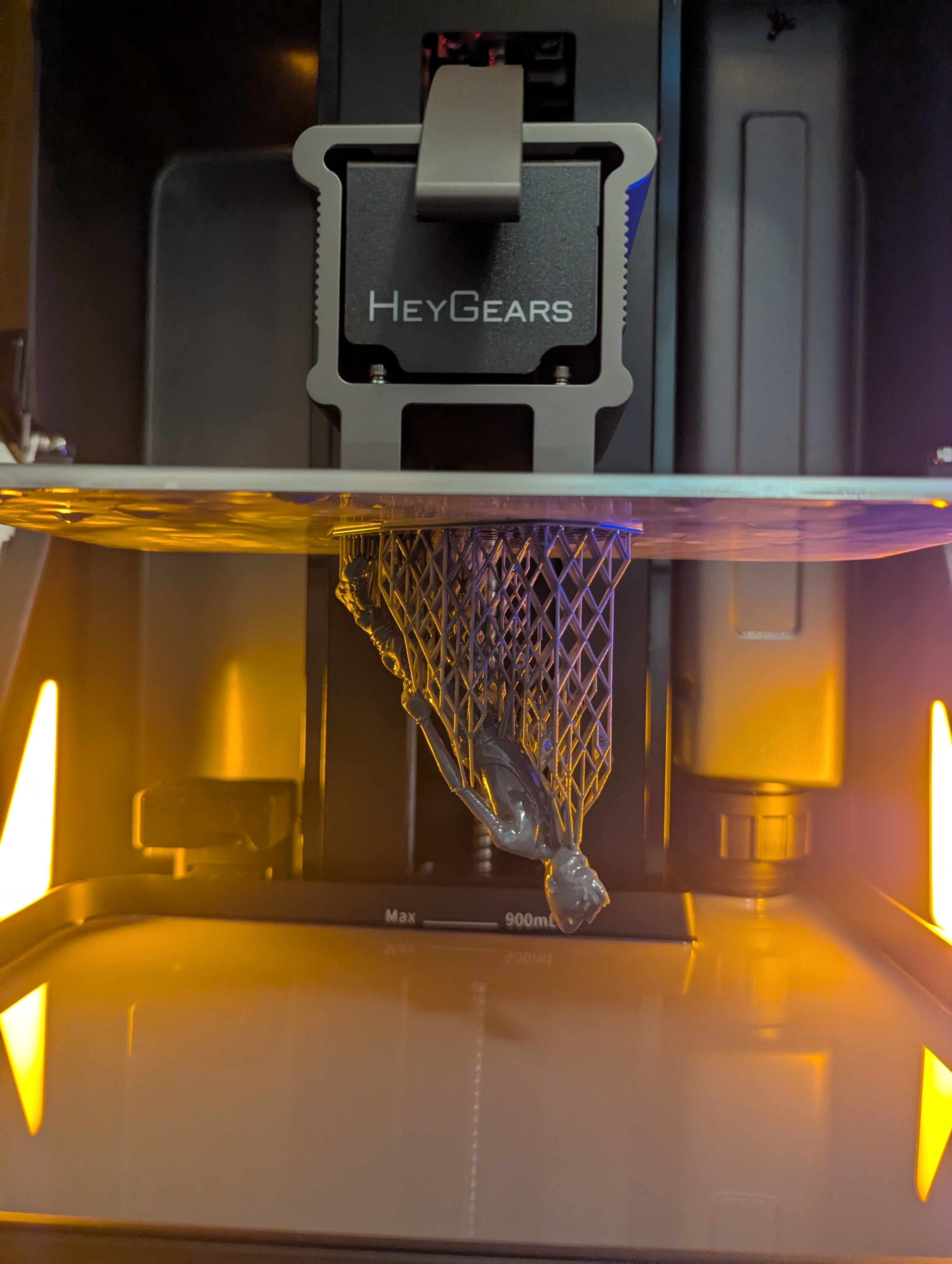 A resin printer producing a detailed sculptural model.
